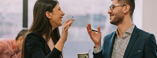 Two businesspeople laughing