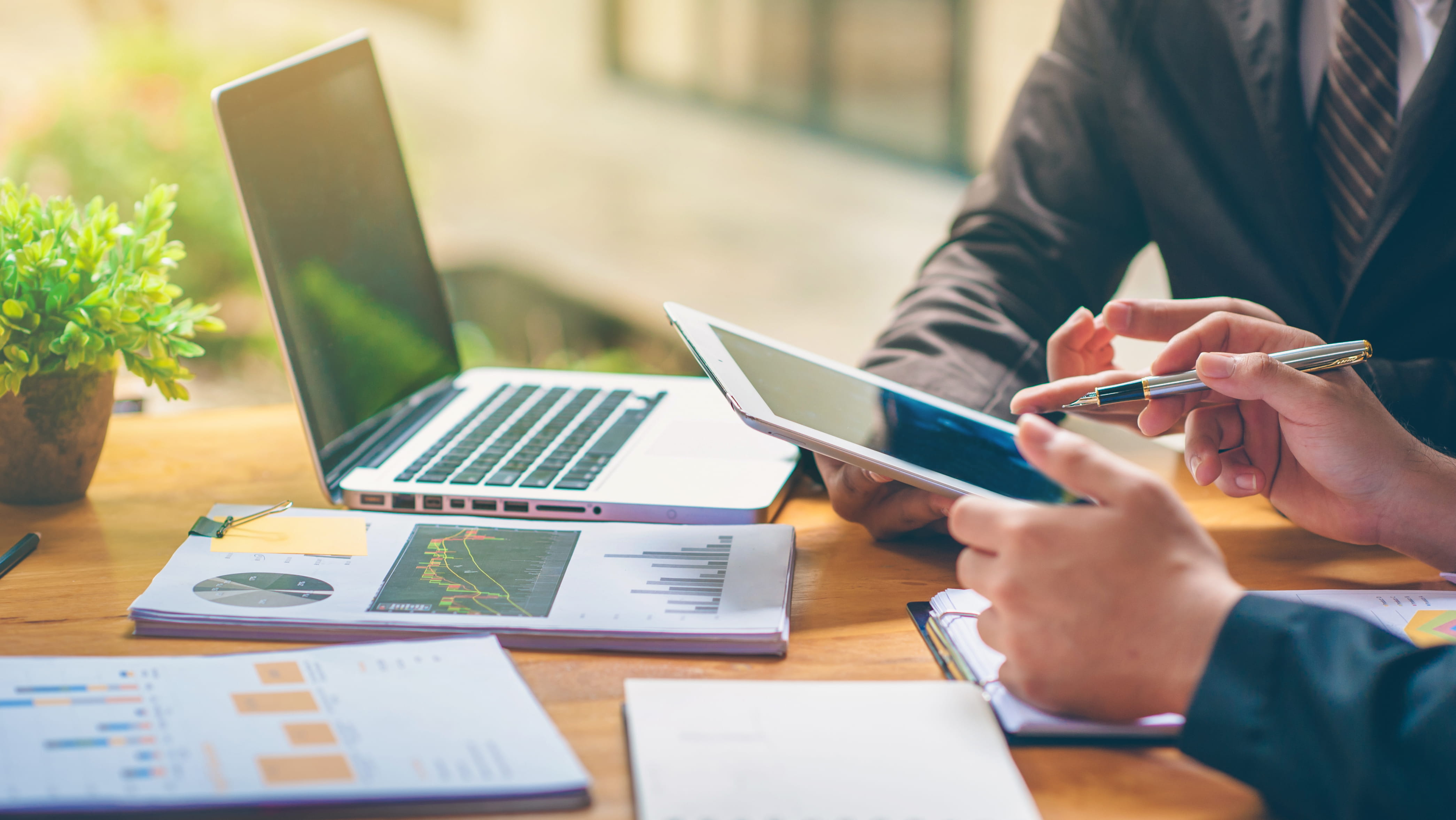 Professionals reviewing financial information in a meeting