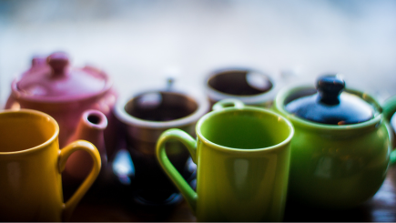 Ceramic multicolored tea cups and pots