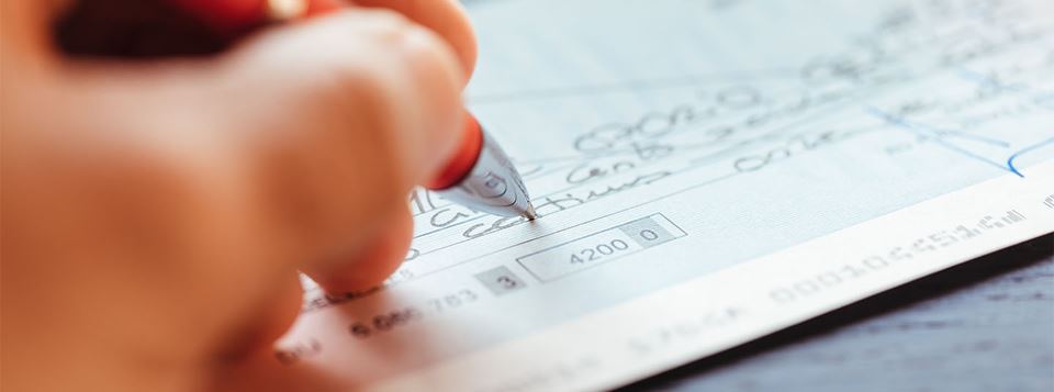 hand writing a check