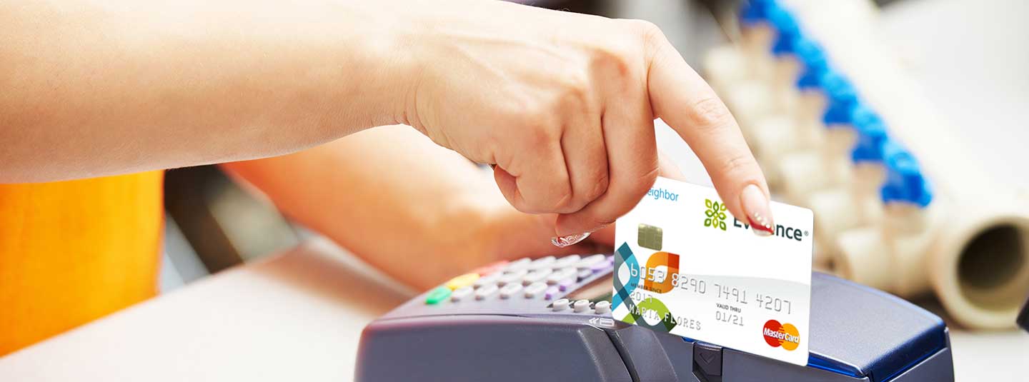 Hand swiping MyNeighbor credit card