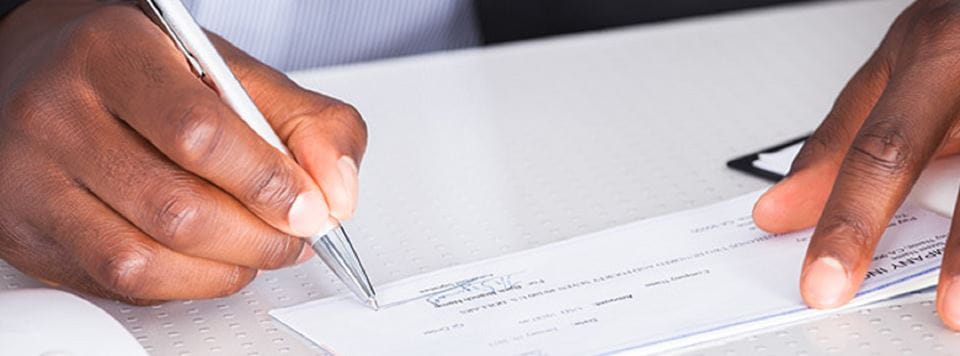 Man signing a check