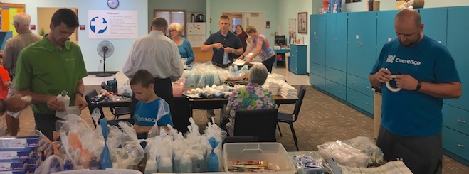 Everence team helps pack care kits for those in need.