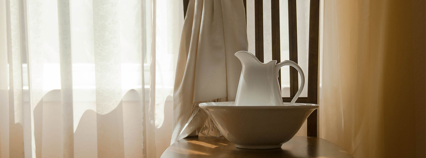 Basin and towel on chair
