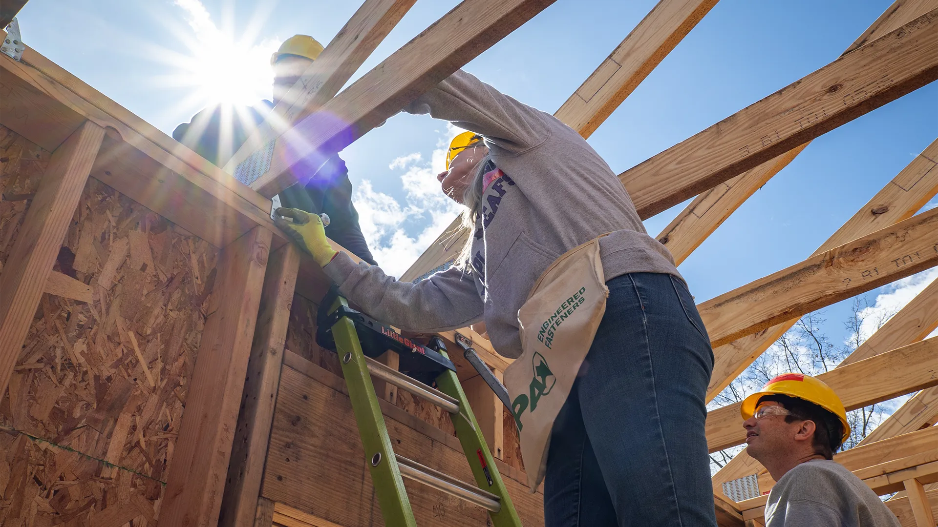 People building a home.