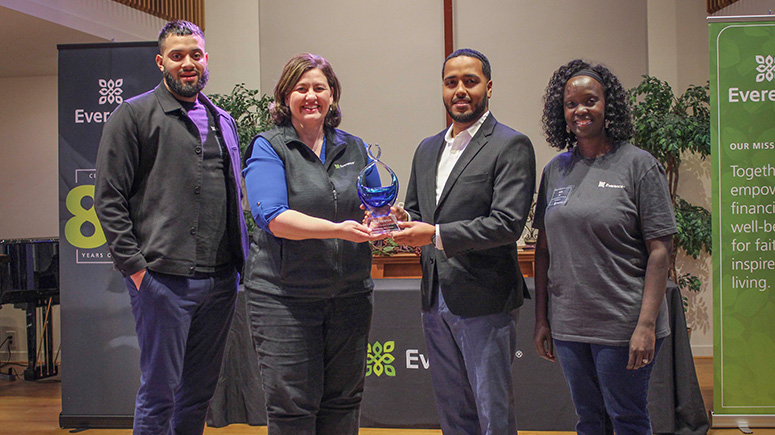 Credit union branch of the year poses with award.