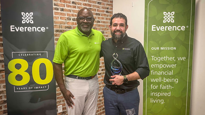 New consultant of the year, Darius Meraj, poses with his award.