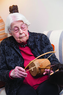 Mary playing another string instrument