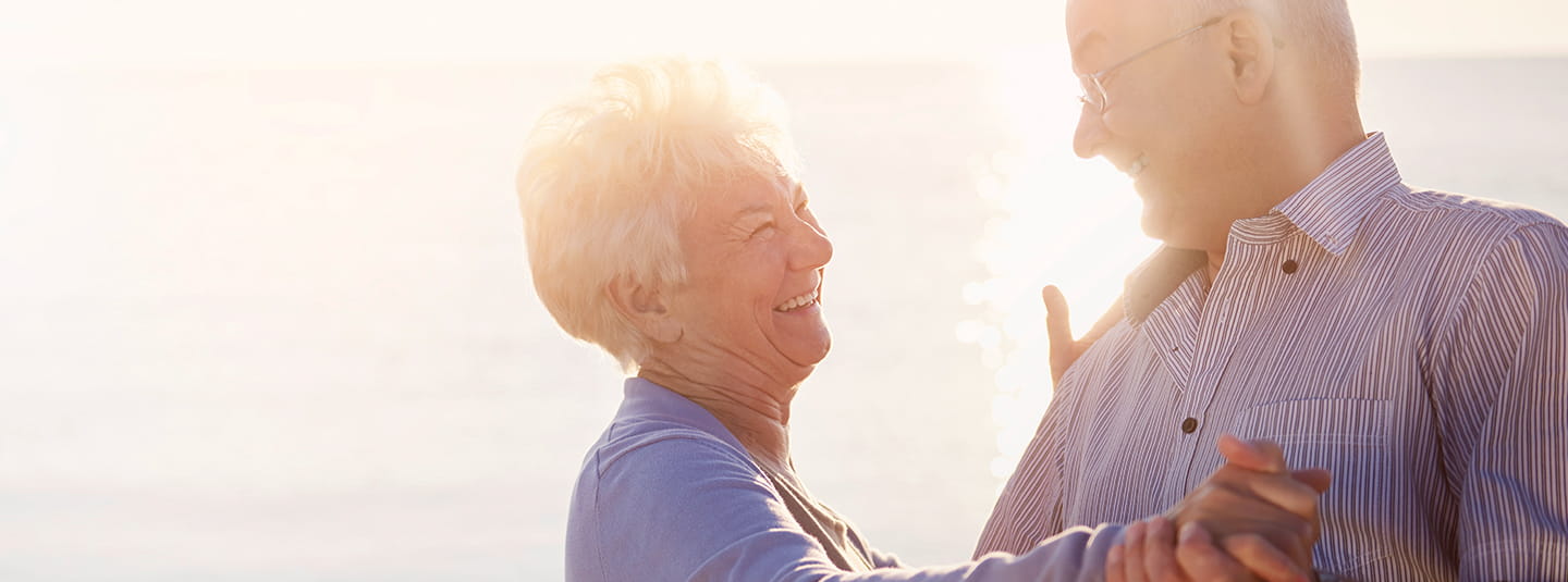 Couple dancing together on the beach