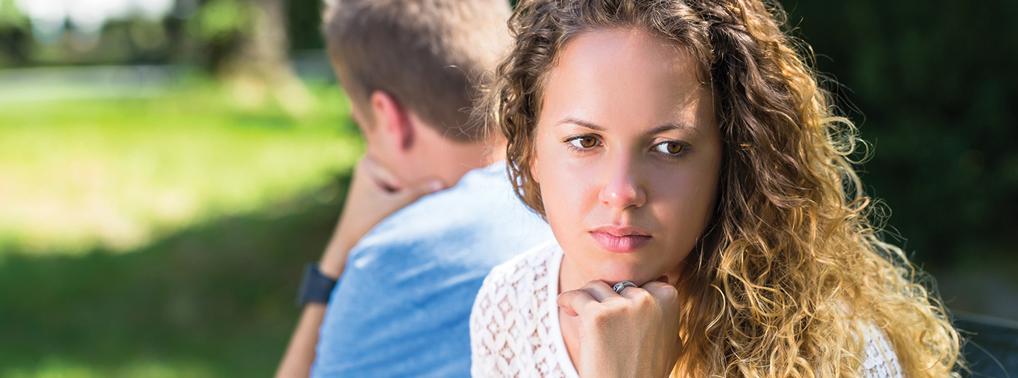Couple looking away from each other in disagreement