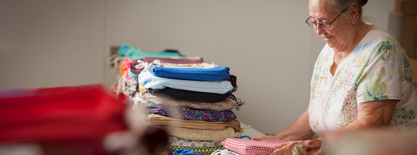 Woman folding clothes