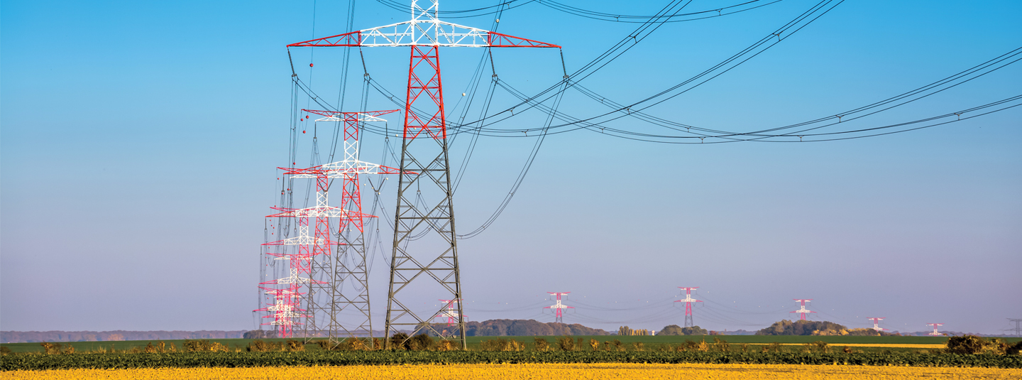 Power lines going across a field