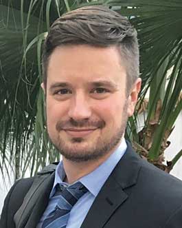 Headshot of man looking into the camera