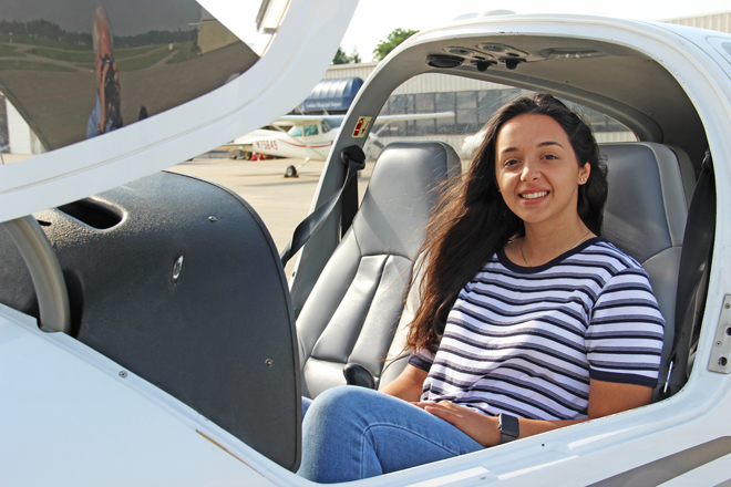 Girl in airplane cockpit
