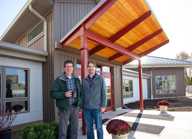 Pastors Karl Shelly and Scott Coulter stand in front of the newly renovated Assembly Mennonite Church in Goshen, Indiana