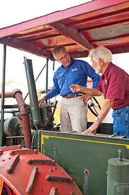Men talking on tractor