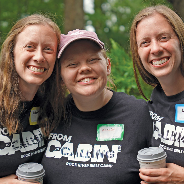 Three women pose for a photo
