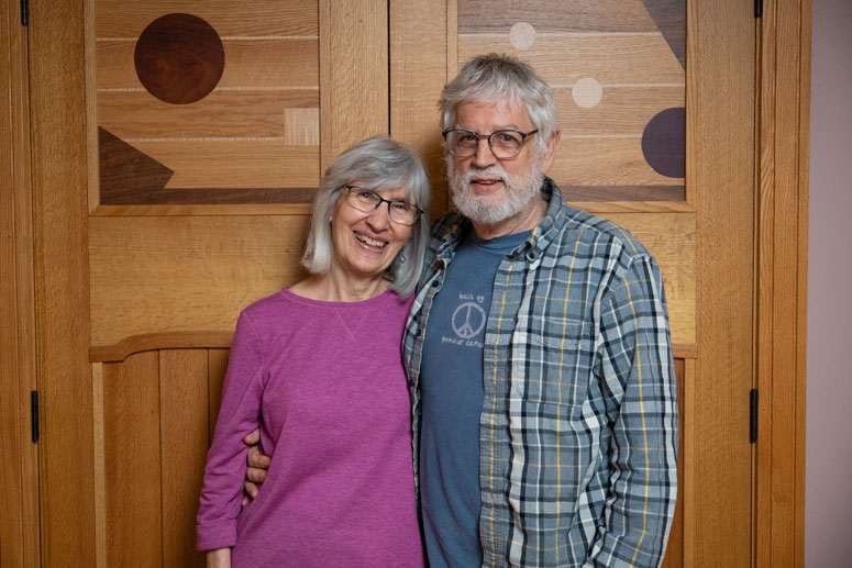 A couple poses for a photo