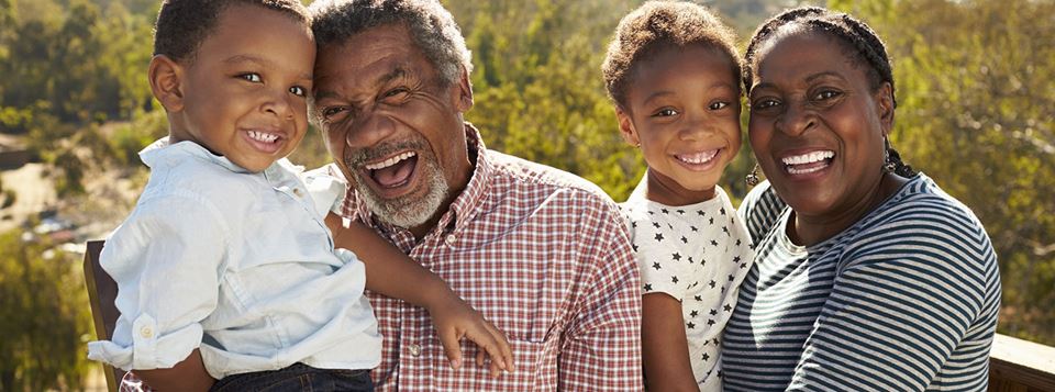 Grandparents and grandchildren laughing together
