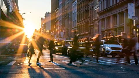 Abstract city street scene at sunset