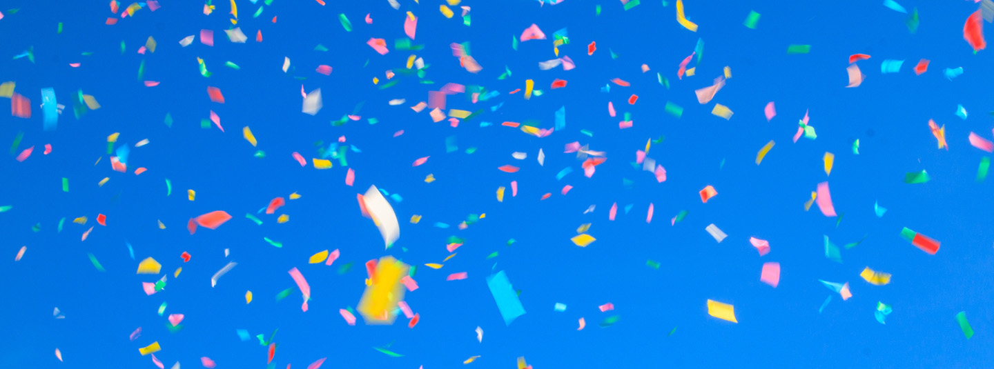 Confetti against a dark blue background