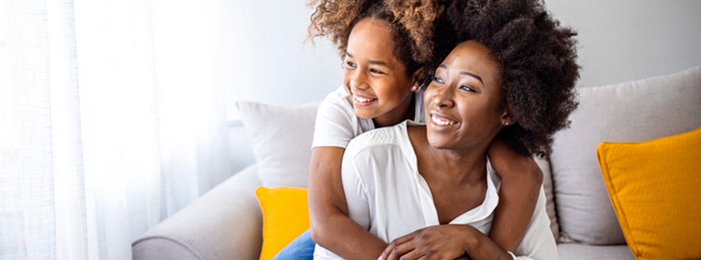 Daughter hugging mom