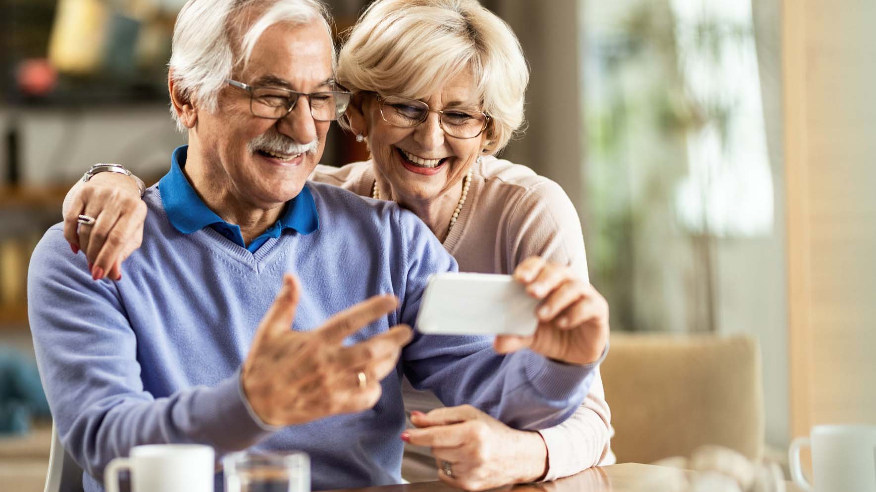 Older couple looking at phone