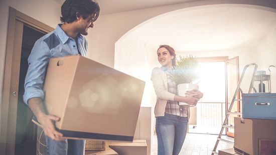 Young couple moving into their new home