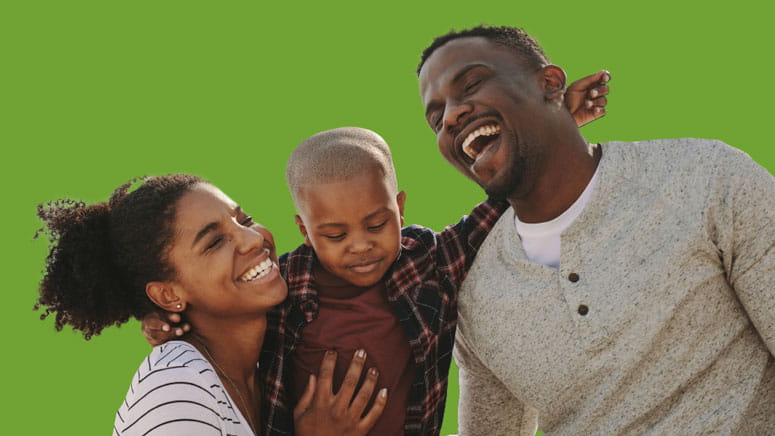 Woman, child, man smiling on green background