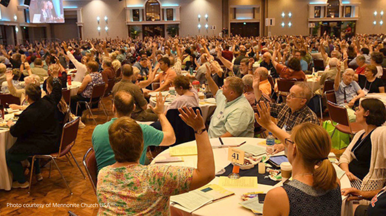 Delegates voting at a Mennonite Church USA convention.