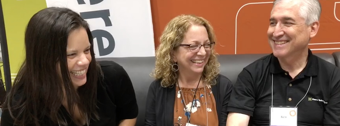 Madalyn Metzger, Sue Hochstetler, and Ken Hochstetler enjoy time at the Everence booth during MennoCon19.