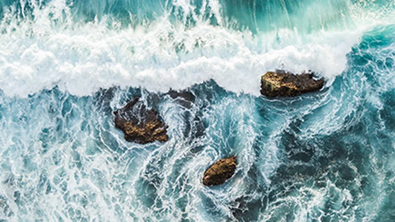 Waves hitting a rocky shore