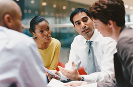 Business meeting at table with four people