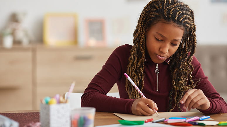Girl working on craft activity