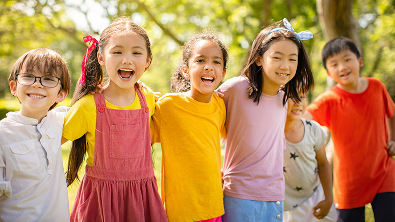 Group of kids standing in a line outside
