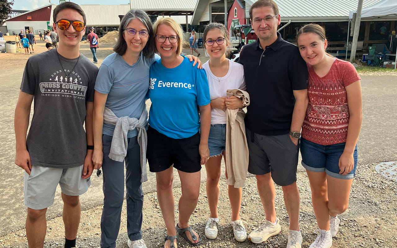 Everence consultant, Audrey Miller, poses with family and friends at the Elkhart County 4-H Fair.