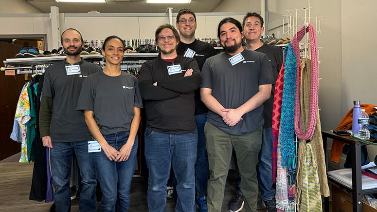 Everence digital team volunteers to help organize closets at the Window.