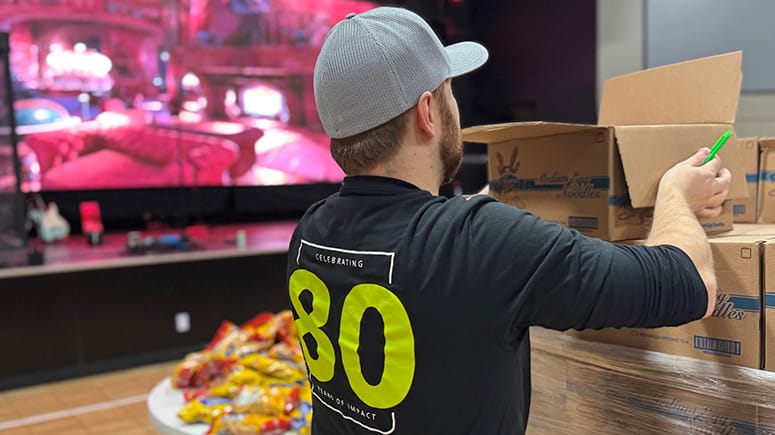 Everence employee, Luke Shyposki, serves at Middlebury, IN food drop