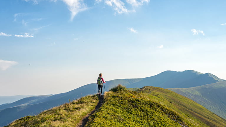 Young woman hiking in the mountains